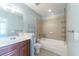 This bathroom includes a shower/tub combo with a vanity and large mirror at 2000 Belle Isle Ave # 204, Mount Pleasant, SC 29464