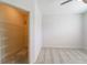 This bedroom includes a walk-in closet with shelving, carpeted floor, and white walls at 2000 Belle Isle Ave # 204, Mount Pleasant, SC 29464