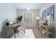 Well-lit home office provides neutral decor, stylish furniture and a large window at 2000 Belle Isle Ave # 204, Mount Pleasant, SC 29464
