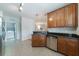 Functional kitchen connects to laundry room, complete with stainless appliances and granite countertops at 2000 Belle Isle Ave # 204, Mount Pleasant, SC 29464