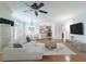 Open-concept living room features hardwood floors, modern furnishings, and views into kitchen at 2000 Belle Isle Ave # 204, Mount Pleasant, SC 29464