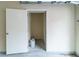 A view of storage room located inside the garage, with an open white door at 2000 Belle Isle Ave # 204, Mount Pleasant, SC 29464