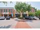 A wide storefront view with shops and parked vehicles in front of the building at 2000 Belle Isle Ave # 204, Mount Pleasant, SC 29464