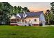 Stunning home exterior featuring a well maintained lawn, rear screened-in porch, and three-car garage at 2040 Shell Ring Cir, Mount Pleasant, SC 29466