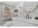 Bathroom with a shower/tub combo, decorative shower curtain, decorative mirror and plenty of natural light at 2040 Shell Ring Cir, Mount Pleasant, SC 29466
