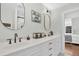 Modern bathroom features double sinks, stylish mirrors and fixtures, with a view of the bedroom at 2040 Shell Ring Cir, Mount Pleasant, SC 29466