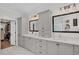 Bathroom with double sinks, stylish light fixtures, and decorative framed mirrors at 2040 Shell Ring Cir, Mount Pleasant, SC 29466