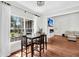 Dining room with a large window overlooking the outdoor area, with hardwood floors and modern decor at 2040 Shell Ring Cir, Mount Pleasant, SC 29466