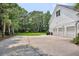 Rear exterior showcasing the house and a spacious three-car garage at 2040 Shell Ring Cir, Mount Pleasant, SC 29466