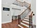Grand foyer showcasing a staircase with wood treads and iron railings at 2040 Shell Ring Cir, Mount Pleasant, SC 29466