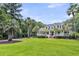 Charming white home features a front porch, dormer windows, and a nicely landscaped yard at 2040 Shell Ring Cir, Mount Pleasant, SC 29466