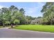 Well-manicured front lawn leading up to a charming two-story home with mature landscaping at 2040 Shell Ring Cir, Mount Pleasant, SC 29466