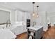 Modern kitchen boasts an island with stylish pendant lights, custom cabinets, and hardwood floors at 2040 Shell Ring Cir, Mount Pleasant, SC 29466