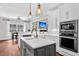 A spacious, modern kitchen featuring an island with sink and stainless steel appliances at 2040 Shell Ring Cir, Mount Pleasant, SC 29466