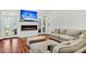 Cozy living room with fireplace, tv, plush seating, and hardwood floors at 2040 Shell Ring Cir, Mount Pleasant, SC 29466