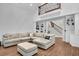 Bright living room featuring a sectional sofa and open staircase at 2040 Shell Ring Cir, Mount Pleasant, SC 29466