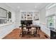 Home office with built-in bookshelves, natural light, and hardwood floors at 2040 Shell Ring Cir, Mount Pleasant, SC 29466
