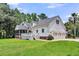 Rear exterior showing a screened porch, deck, and three car garage at 2040 Shell Ring Cir, Mount Pleasant, SC 29466
