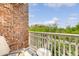 Cozy balcony featuring a chair, small table, and views of the lush greenery and surrounding buildings at 260 Seven Farms Dr # 306, Charleston, SC 29492