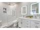 Modern bathroom with double vanity, backlit mirrors, and frameless glass shower at 260 Seven Farms Dr # 306, Charleston, SC 29492