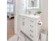 Bright bathroom with a white vanity, drawers, and illuminated mirror showcasing modern elegance at 260 Seven Farms Dr # 306, Charleston, SC 29492