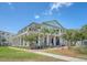 Impressive multi-story building with balconies, large windows, and well-maintained landscaping at 260 Seven Farms Dr # 306, Charleston, SC 29492