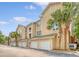 Townhome featuring multiple garages, and palm trees at 260 Seven Farms Dr # 306, Charleston, SC 29492