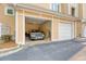 Spacious two car garage featuring an overhead light and a car inside, offering ample parking space at 260 Seven Farms Dr # 306, Charleston, SC 29492