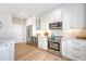 Modern kitchen with stainless steel appliances, marble countertops, and ample storage at 260 Seven Farms Dr # 306, Charleston, SC 29492