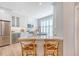 Modern kitchen with white cabinetry, marble countertops, and stainless steel appliances at 260 Seven Farms Dr # 306, Charleston, SC 29492