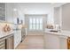 Well-equipped kitchen with white cabinets, stainless appliances, and ample counter space at 260 Seven Farms Dr # 306, Charleston, SC 29492