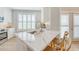 Modern kitchen featuring a marble countertop island with seating and bright white cabinets at 260 Seven Farms Dr # 306, Charleston, SC 29492