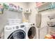 Well-organized laundry room featuring front-loading washer/dryer and shelving for storage at 260 Seven Farms Dr # 306, Charleston, SC 29492