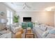 Bright living room with neutral tones, plantation shutters, and comfortable seating at 260 Seven Farms Dr # 306, Charleston, SC 29492