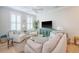 Cozy living room with a stylish turquoise console table and plush seating arrangement at 260 Seven Farms Dr # 306, Charleston, SC 29492