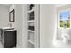 Bright bathroom with a sleek vanity, open shelving for towels, and a classic toilet at 2720 Oak Manor Dr, Mount Pleasant, SC 29466