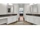 Elegant bathroom with dual vanities, decorative mirrors, and stylish white cabinetry at 2720 Oak Manor Dr, Mount Pleasant, SC 29466