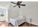Cozy bedroom featuring a fan, hardwood floors, and natural light from the window at 2720 Oak Manor Dr, Mount Pleasant, SC 29466
