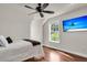 Bright bedroom featuring ceiling fan, natural light and decorative television at 2720 Oak Manor Dr, Mount Pleasant, SC 29466