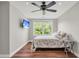 Well-lit bedroom featuring a ceiling fan and a large window with a peaceful view at 2720 Oak Manor Dr, Mount Pleasant, SC 29466