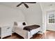 Cozy bedroom featuring a ceiling fan, hardwood floors, and natural light at 2720 Oak Manor Dr, Mount Pleasant, SC 29466
