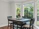 Charming breakfast nook features a wooden table with seating for four and large windows offering natural light at 2720 Oak Manor Dr, Mount Pleasant, SC 29466