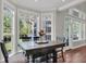 Bright dining area with large windows, a wooden table, and views of the outdoors at 2720 Oak Manor Dr, Mount Pleasant, SC 29466