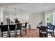 Dining area next to a kitchen featuring a breakfast bar, pendant lights, and stainless steel appliances at 2720 Oak Manor Dr, Mount Pleasant, SC 29466