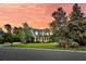Stunning two-story home boasts mature trees, manicured lawn, and a cozy front porch at 2720 Oak Manor Dr, Mount Pleasant, SC 29466