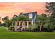 Beautiful two-story home offers lush landscaping, dormer windows, and a welcoming porch at 2720 Oak Manor Dr, Mount Pleasant, SC 29466