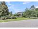 Charming two-story home with manicured lawn and mature trees, nestled in a serene neighborhood at 2720 Oak Manor Dr, Mount Pleasant, SC 29466
