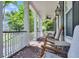 Spacious front porch features brick flooring, rocking chairs, and picturesque surroundings at 2720 Oak Manor Dr, Mount Pleasant, SC 29466