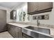Laundry room features a stainless steel sink, grey cabinets, granite countertop and natural light at 2720 Oak Manor Dr, Mount Pleasant, SC 29466