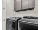 Laundry room featuring sleek, modern black washer and dryer units at 2720 Oak Manor Dr, Mount Pleasant, SC 29466